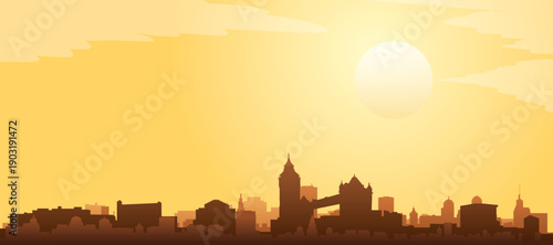 Golden yellow panoramic poster of the city skyline with misty background buildings and clouds of LONDON, UNITED KINGDOM