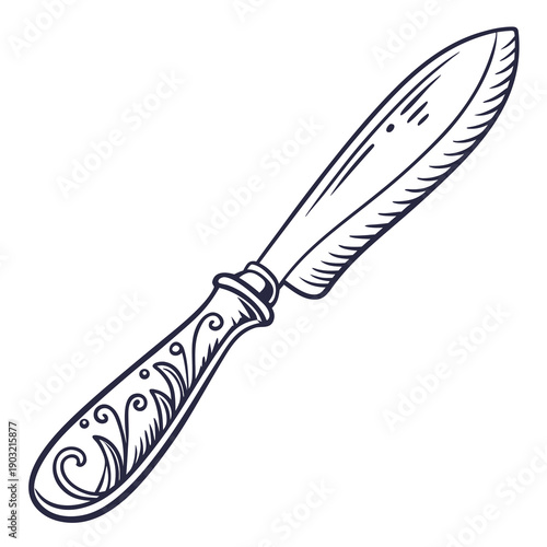 An ornate, vintage butter knife with intricate designs on the handle.