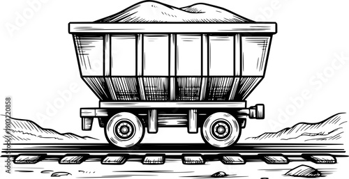 Vintage black and white of a loaded coal mine cart railroad tracks train