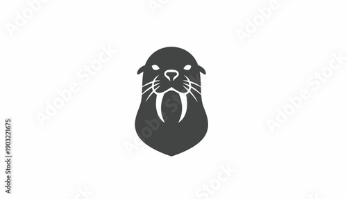 Stylized dark grey walrus head logo with prominent tusks and whiskers on a white background, facing forward, representing strength and arctic wildlife.