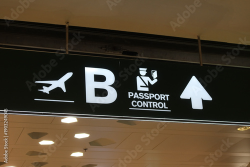 Passport control and airplane sign at Milano Malpensa Airport in Milan, Italy. May 21, 2025
