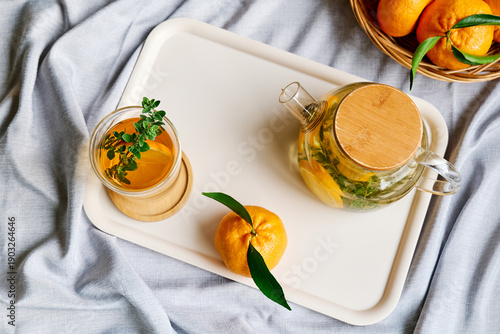 Citrus hot beverage in thermic glass on a table
