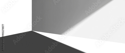 A dimly lit corner showing stark shadows and geometric shapes, angled perspective