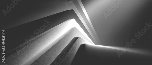 Abstract grayscale artwork featuring sharp angles and linear gradients against a dark backdrop