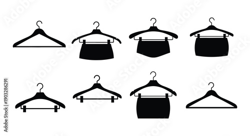 Black and white illustration of clothing hangers with garments