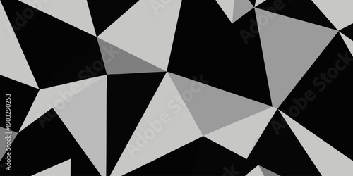 Geometric Pattern Featuring Triangles in Various Shades of Gray and Black