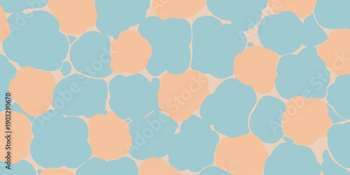 A vibrant pattern of blue and peach-colored circles overlapping in a mesmerizing design viewed from directly above