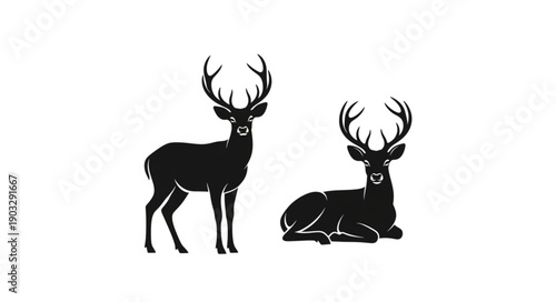 Two Silhouette Deer with Antlers Standing and Sitting.