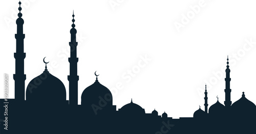 Dark silhouette of multiple mosque domes and tall minarets creates a dramatic religious architectural skyline against a.