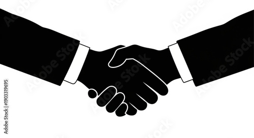 Two business people shaking hands in agreement silhouette.