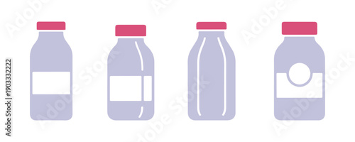 a variety of milk bottles with different colorful designs placed on a white surface

