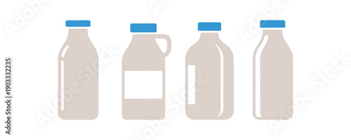 a variety of milk bottles with different colorful designs placed on a white surface

