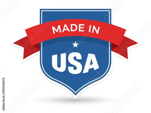 A blue shield emblem with a red ribbon displaying 'Made in USA' on a transparent background from a direct viewpoint