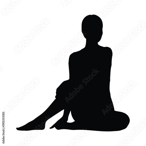 Black silhouette of a woman sitting cross-legged on the floor