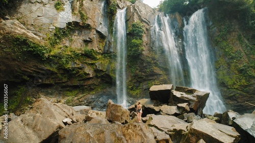 Wallpaper Mural Woman exploring rocks near the base of Nauyaca Waterfalls in Costa Rica. Torontodigital.ca