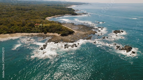 Wallpaper Mural Mirador Marbella by green forest and rocky beach with ocean waves in Costa Rica. Torontodigital.ca