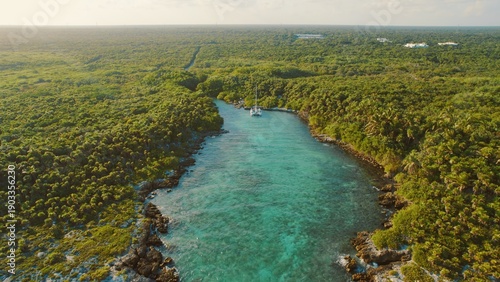Wallpaper Mural Aerial view of turquoise lagoon with yacht in tropical Yucatan forest Mexico. Torontodigital.ca