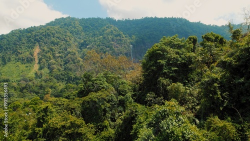 Wallpaper Mural Drone flight over dense tropical forest and Diamond Waterfall in Costa Rica. Torontodigital.ca