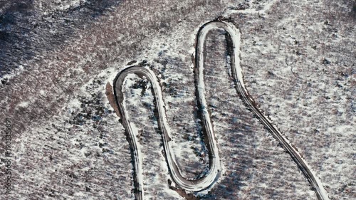 Winding mountain road aerial view in winter
