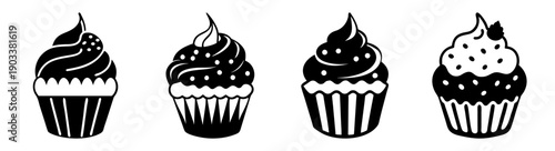 Four colorful cupcakes with swirl frosting and sprinkles isolated on white background