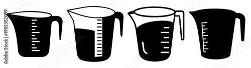 Set of four black and clear measuring cups with handles isolated on white background