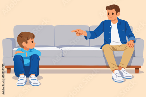 Father talking seriously to his young son sitting on a sofa in the living room.