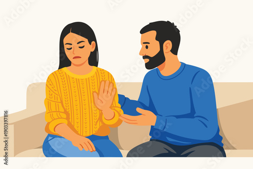 Couple having a serious argument while sitting on a sofa.