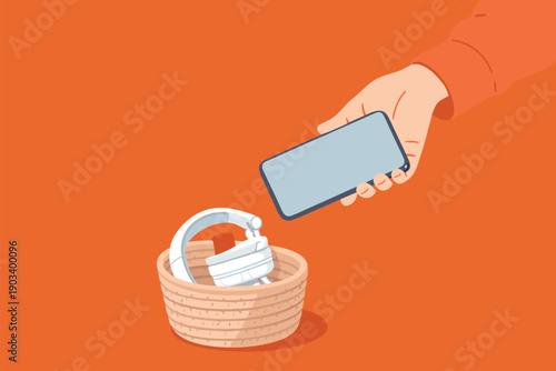 Putting a smartphone into a basket for a digital detox session.