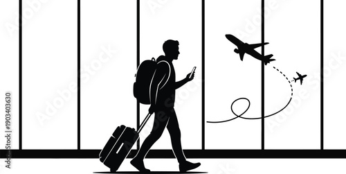 Traveler walking through airport with luggage and phone in hand