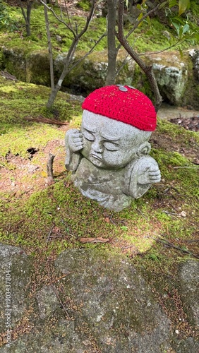 Stone statue with red woolen hat in Japan  buddhist temple, Daishoin  bodhisattva 