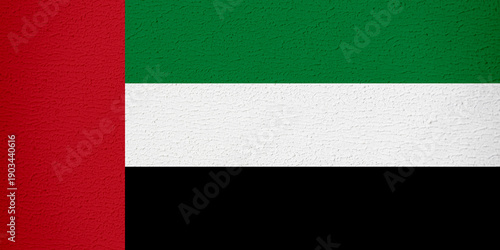 Foto United Arab Emirates Flag with Wall Texture Background