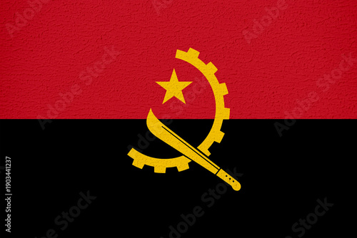 Foto Angola Flag with Wall Texture Background