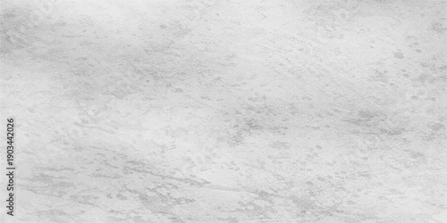 A close up textured white surface resembling snow or concrete provides a blank grunge pattern for winter design backgrounds