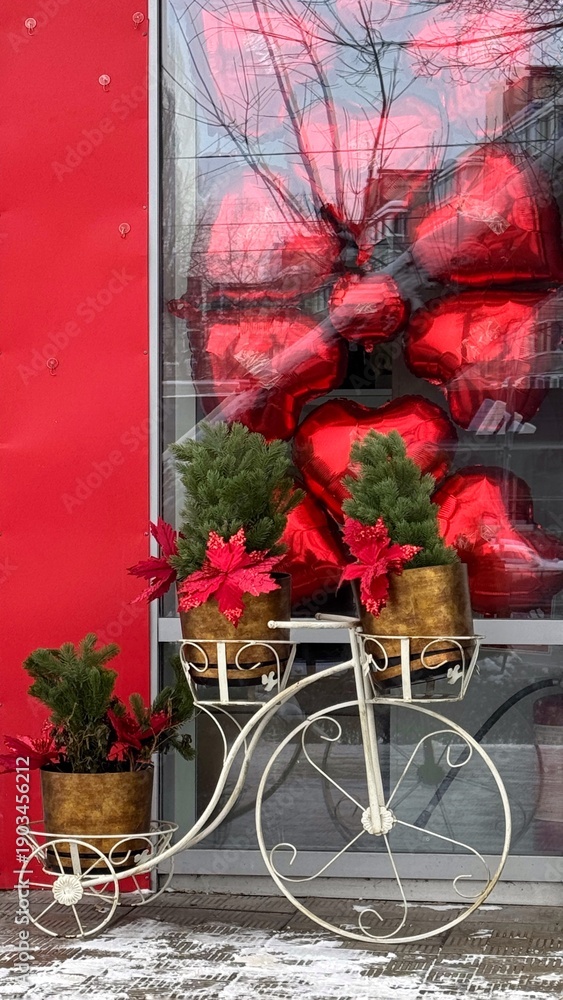 Obraz premium Bicycle and flowers with decorations for Saint Valentines day, red balloons in a shape of heart