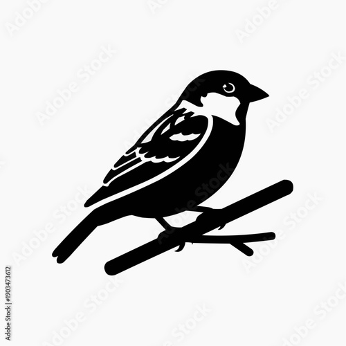 A striking black silhouette of a small bird perched upon a slender branch creating a bold image silhouette