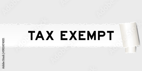 Ripped gray paper background that have word tax exempt under torn part