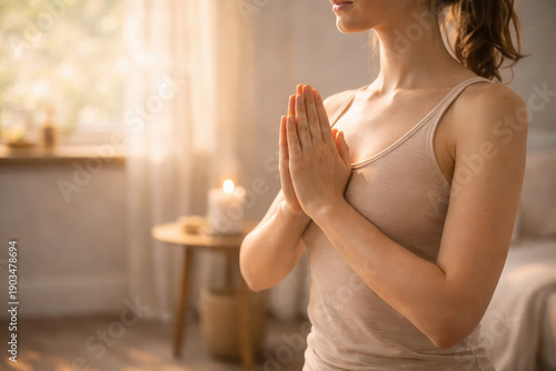 Wallpaper Mural Calm morning yoga routine prayer hands woman meditation home peaceful lifestyle wellness soft light candle background mindful routines gratitude practice Torontodigital.ca