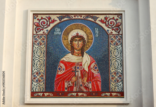 Wallpaper Mural Plast, Russia - November 15, 2025: An image of Saint Barbara is painted in the style of a church mosaic on the façade of the Orthodox Church of the Holy Great Martyr Barbara Torontodigital.ca