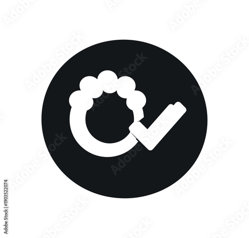 Flat vector icon only micro badge small solid black circle containing single simple white pictogram teething ring with checkmark