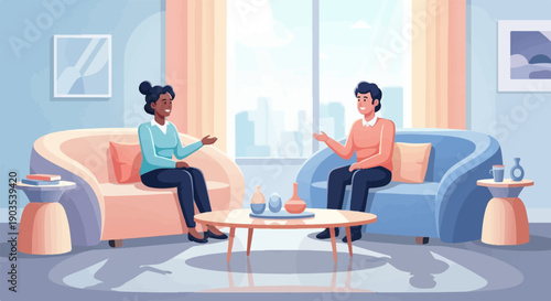 Two people casually conversing on sofas in a bright, modern living room