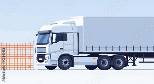 White semi-trailer truck parked next to orange construction barrier