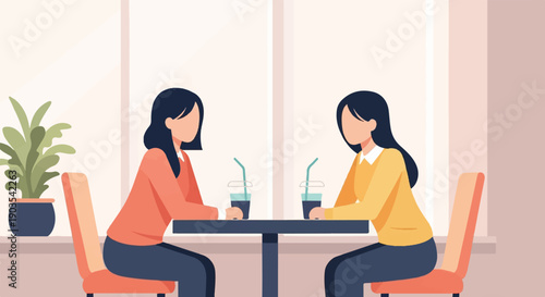 Two women sit at a table with drinks, a plant on the side