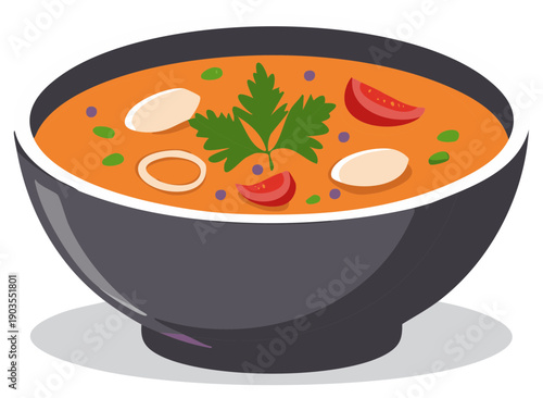 Delicious hearty tomato soup in a dark bowl with fresh ingredients and herbs for a healthy meal