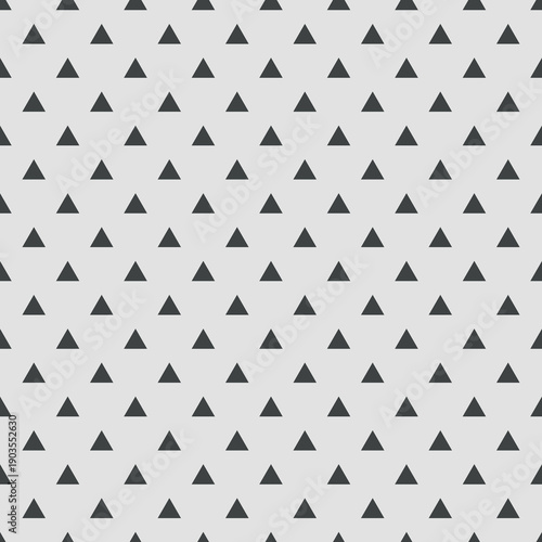 Tile vector pattern with black triangles on grey background 