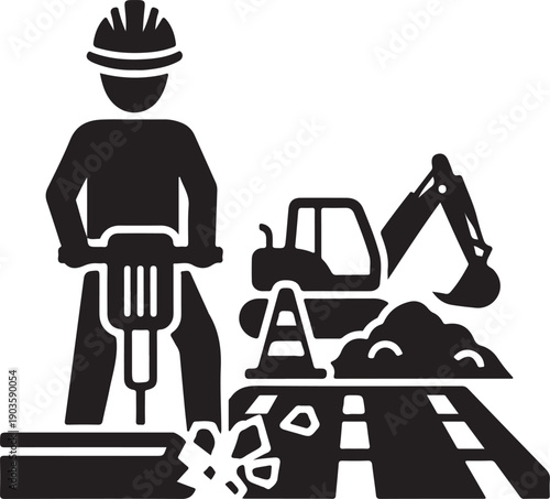 Construction worker operating jackhammer near excavator on road construction site