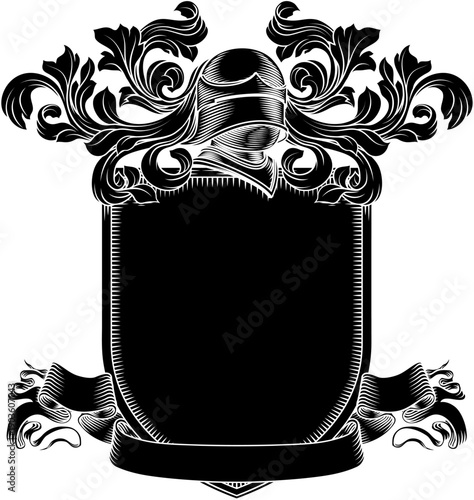Coat of arms crest knight family medieval shield heraldry heraldic armorial motif. Featuring a knights helm helmet in a vintage etching engraving woodcut style 
