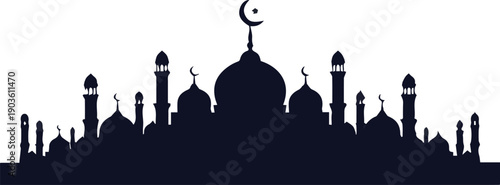 Silhouette of mosque with crescent moon against a clear sky during dusk from a distant viewpoint