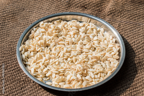 Fényképezés bottle gourd or lauki seeds in a plate under sunlight with jute carpet background