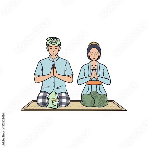 Balinese Couple in Traditional Attire Sitting and Praying