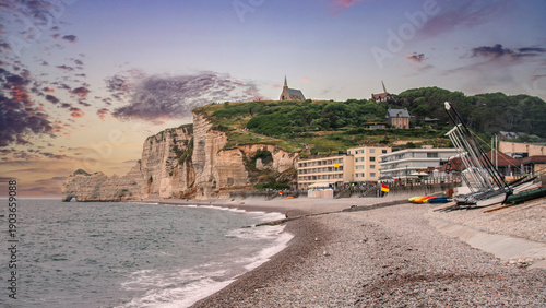 Fotografie The town of Etretat, a famous landmark in France for its cliffs and arches